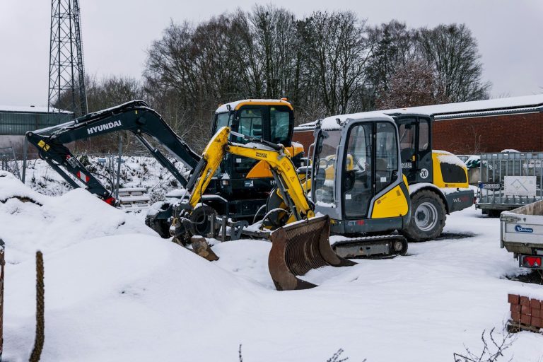 Two excavators parked in the snow